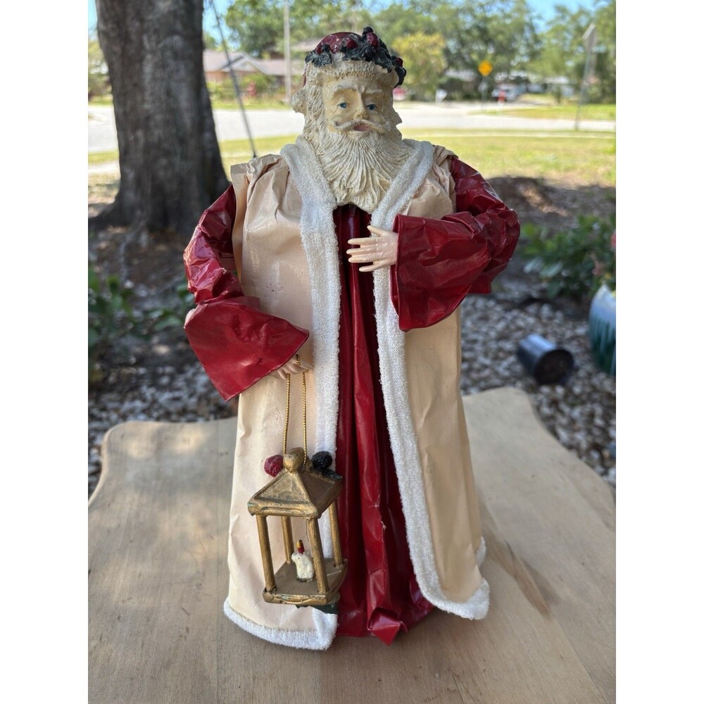 Santa Claus Christmas figurine with lantern, red and cream robe